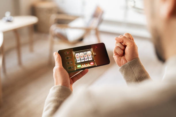 Mobile phone displaying live Over Under odds for a football match